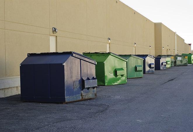 metallic dumpster units staged for construction garbage in Andale